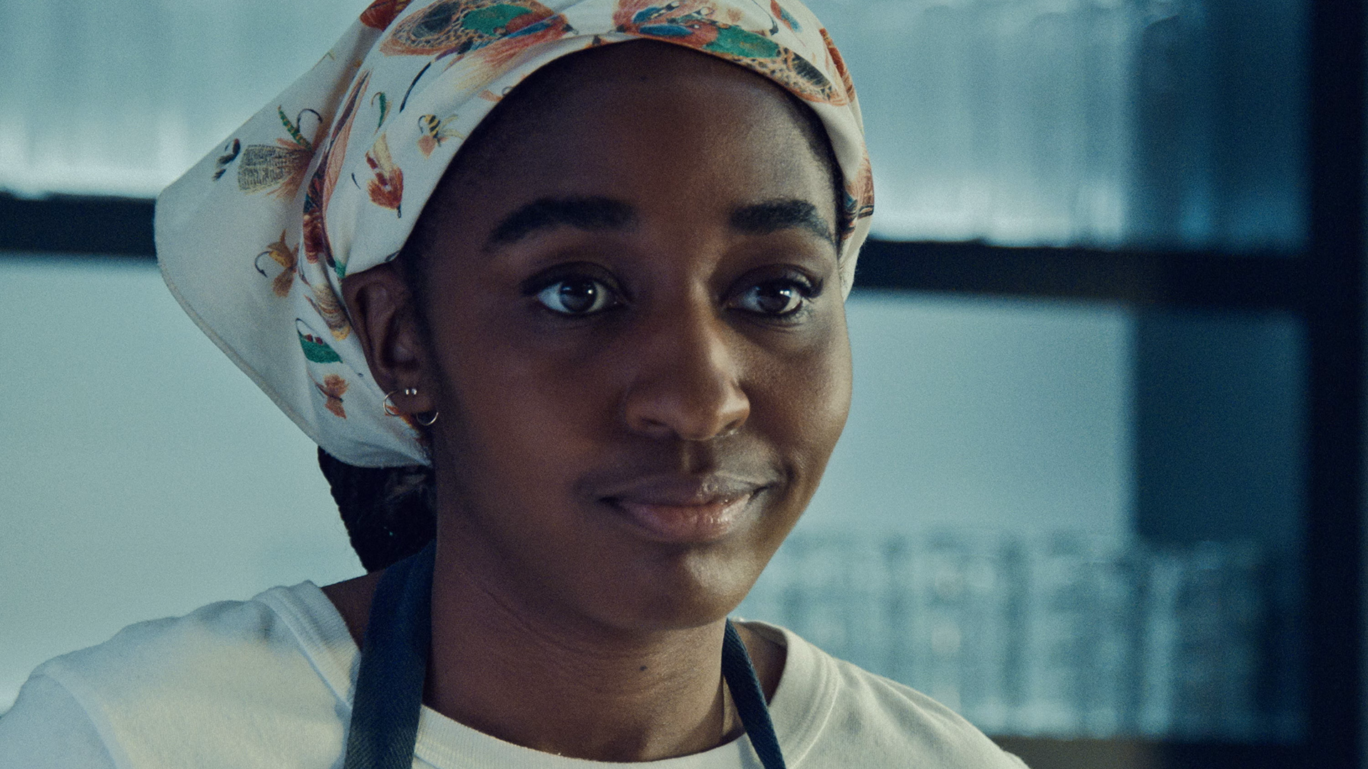 A closeup of Sydney (Ayo Edebiri) in The Bear