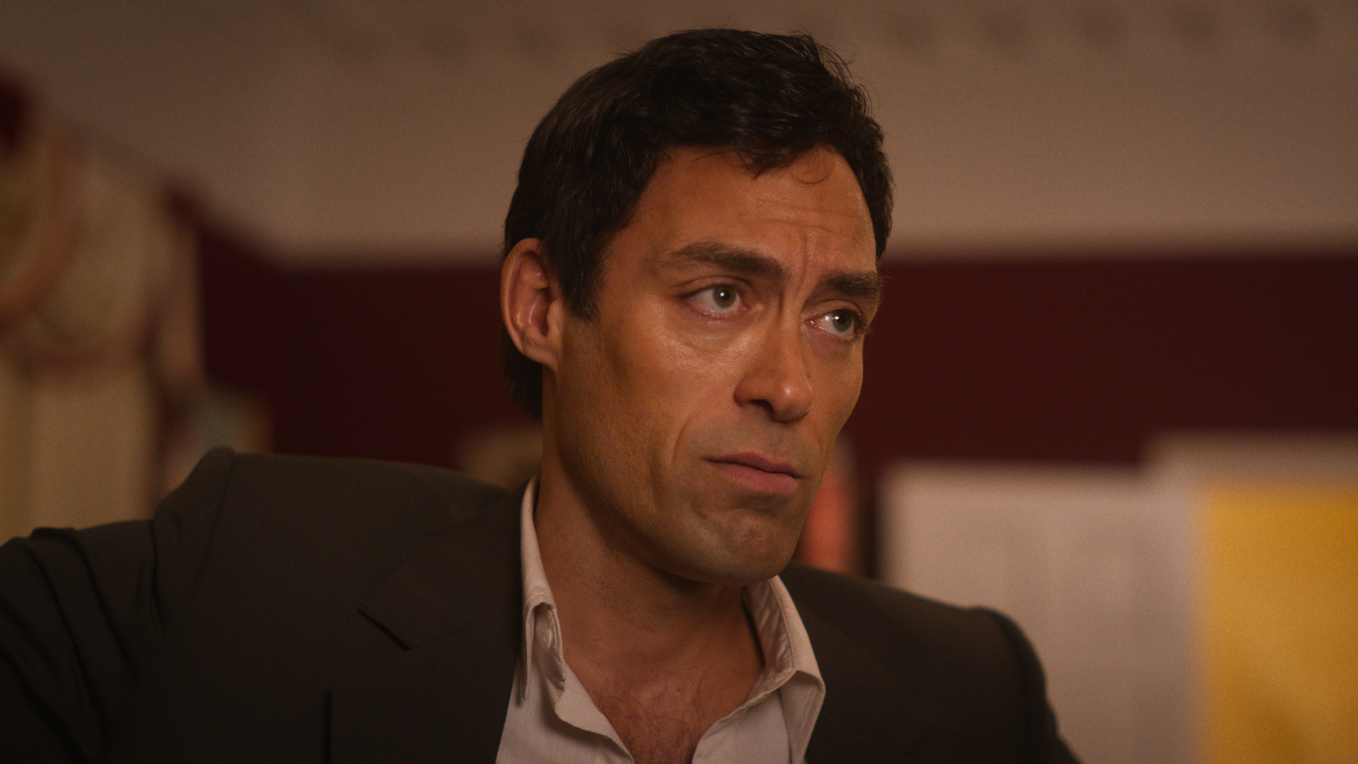 This image features actor Alex Hassell in his role as Rupert Campbell-Black in the Disney+ series Rivals.