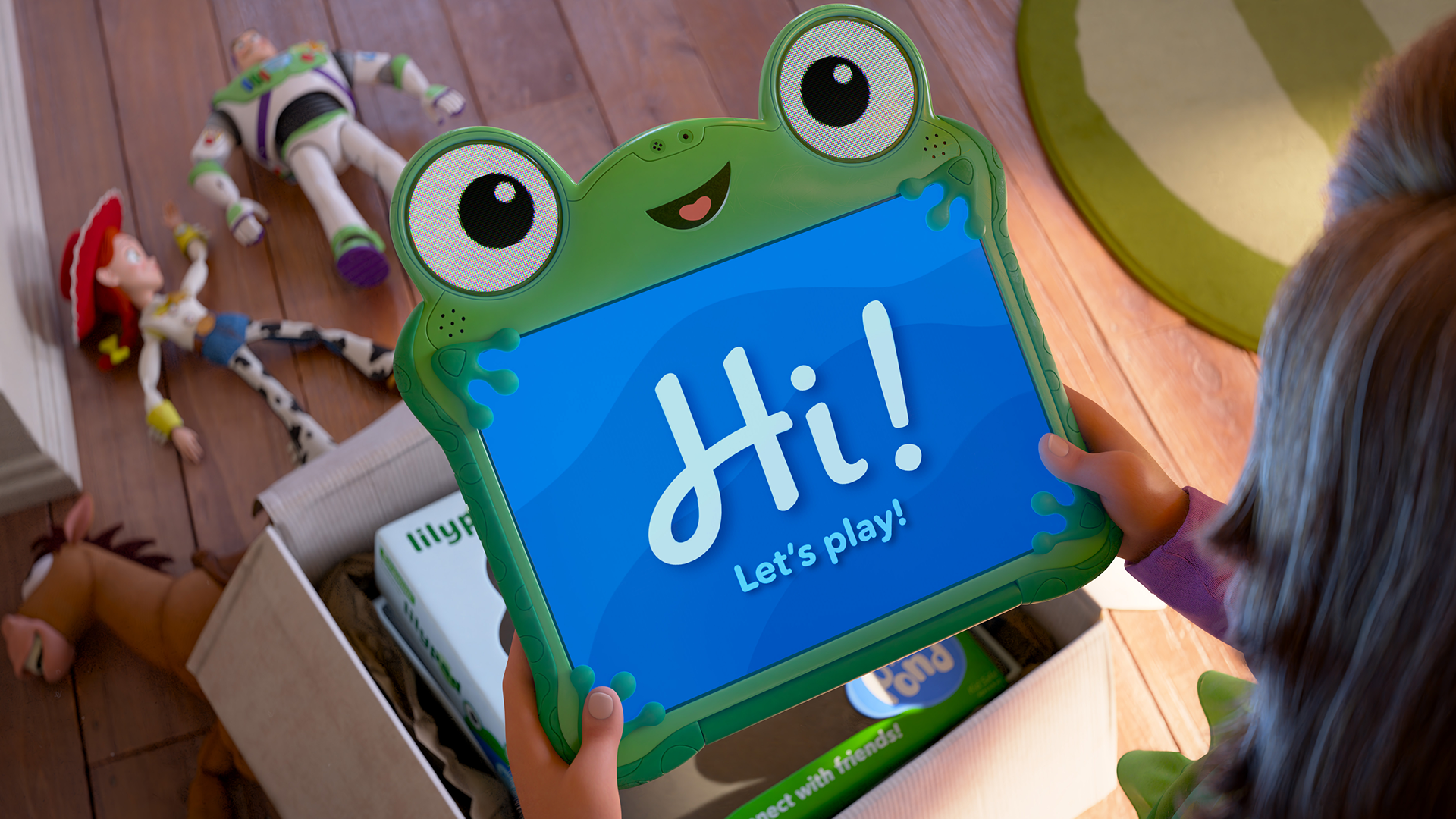 An official promotional image from Disney and Pixar's "Toy Story 5" shows a child's hands unboxing a bright green, frog-shaped smart tablet named Lilypad (Greta Lee) displaying the greeting "Hi! Let's play!" on its blue screen, while the classic toys Buzz Lightyear (Tim Allen), Jessie (Joan Cusack), and Bullseye lie cast aside on the wooden floor nearby.