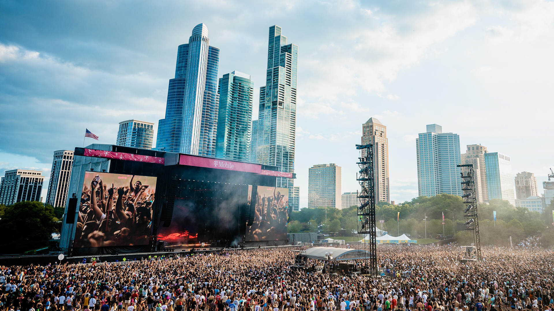 A shot of a stage at Lollapalooza with the cityscape in the background