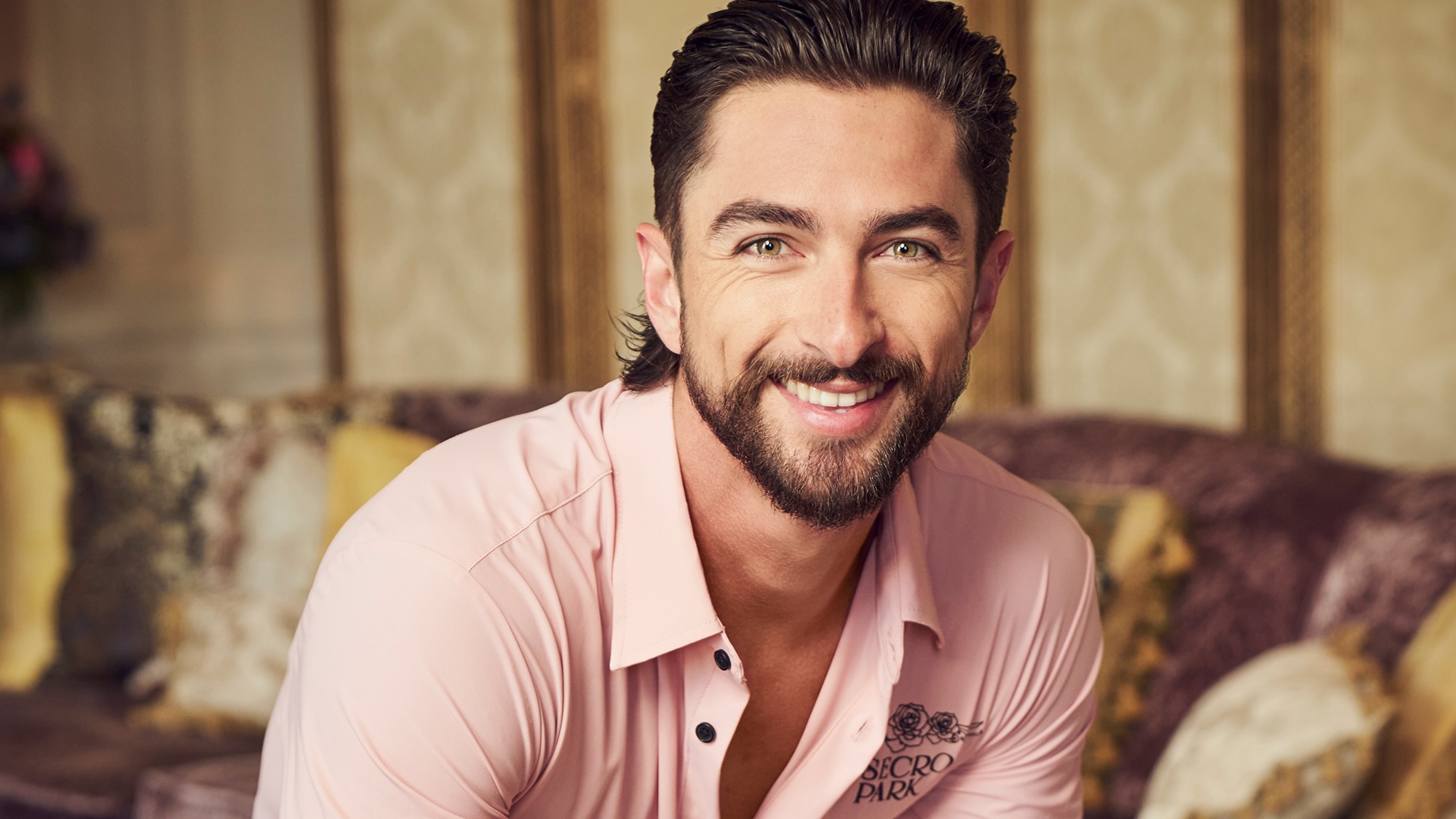 A headshot of bartender Sam for Season 3 of Vanderpump Villa.