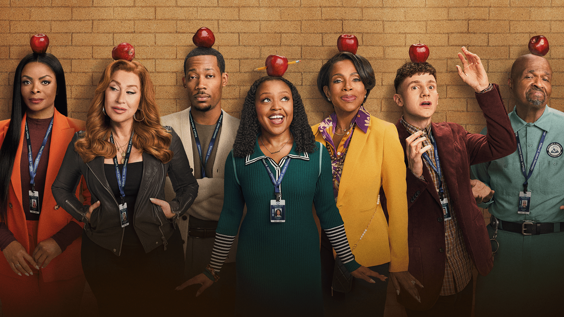 A poster for Abbott Elementary with the cast all posing with apples on their heads