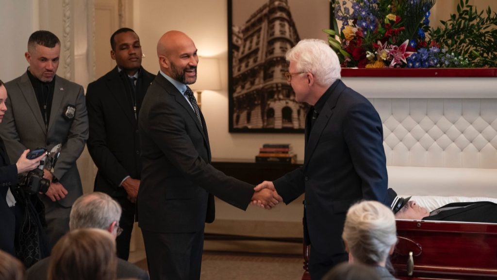 Keegan-Michael Key smiles and shakes hands with Steve Martin