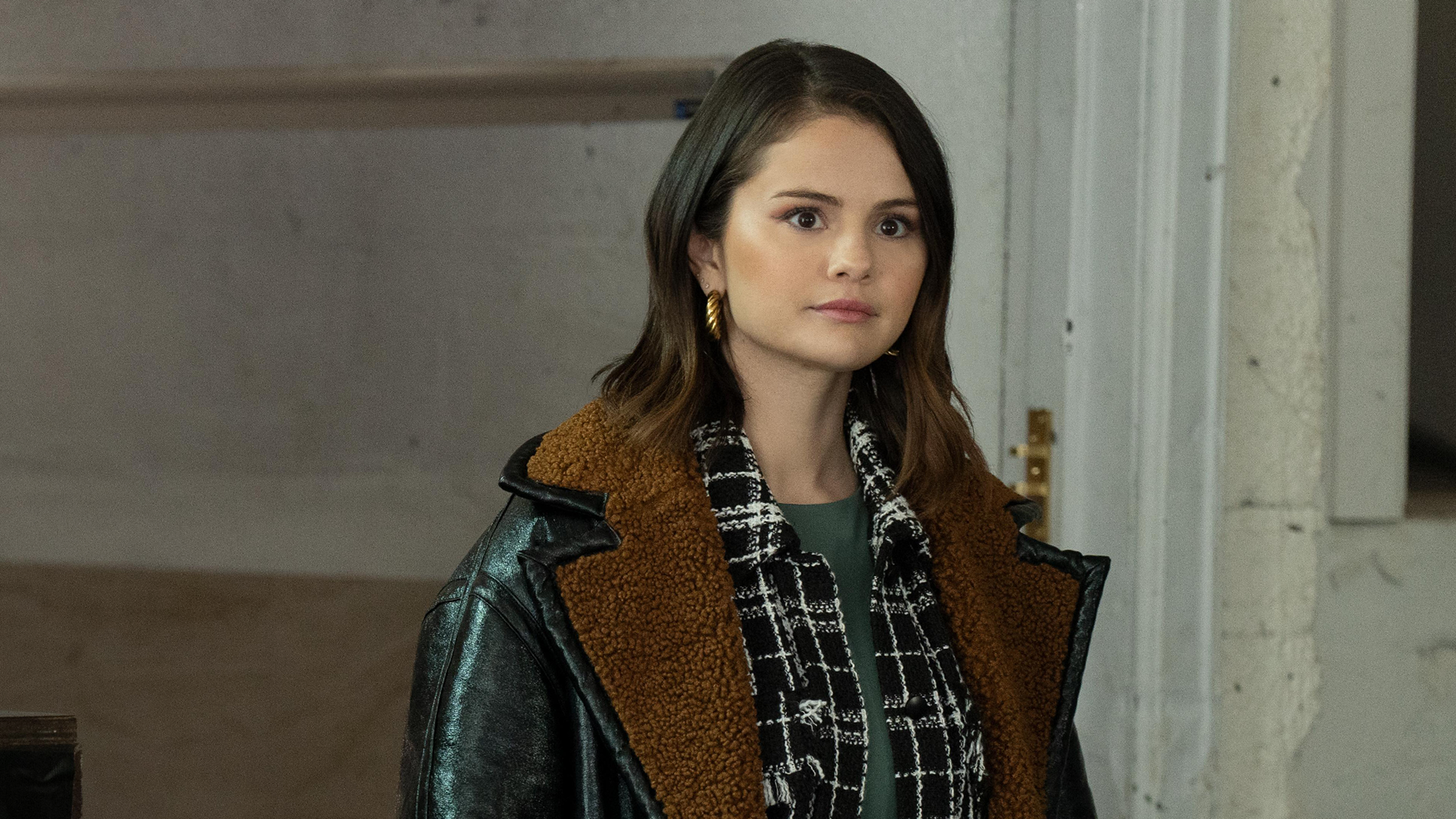 This image features Selena Gomez as Mabel Mora from the Hulu series Only Murders in the Building.