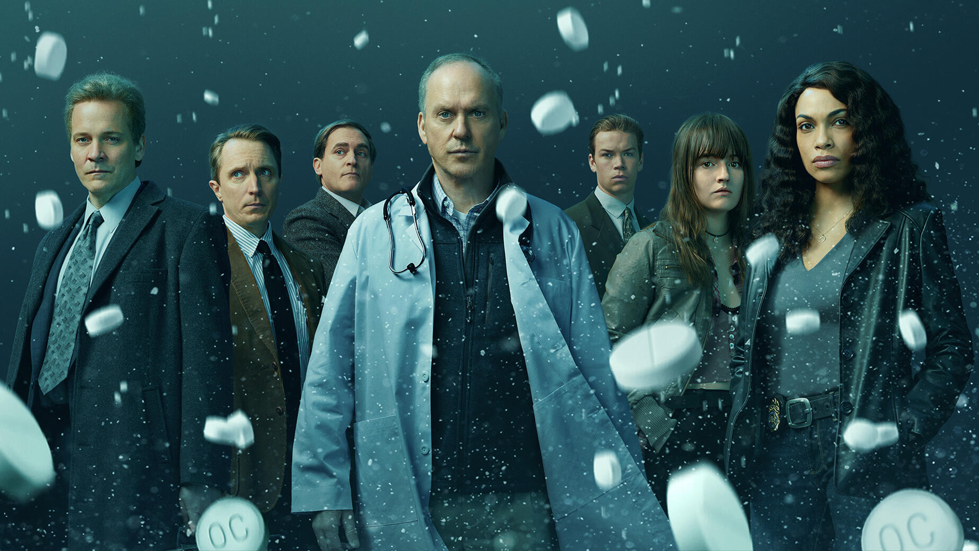 The cast of Dopesick ona poster for the show, with white pills falling around them