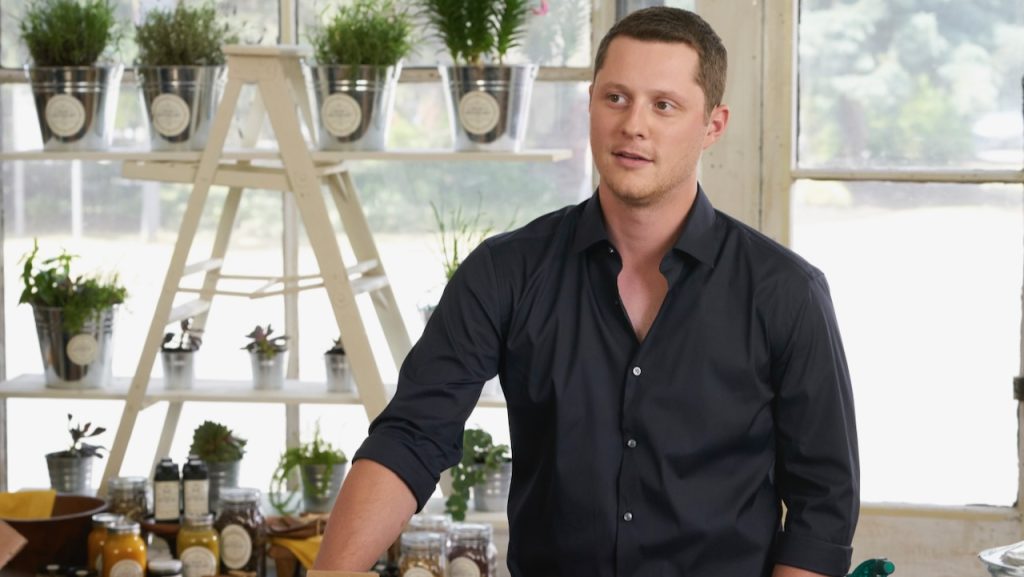 A still image of Noah Reid as Patrick Brewer in an episode of Schitt’s Creek.