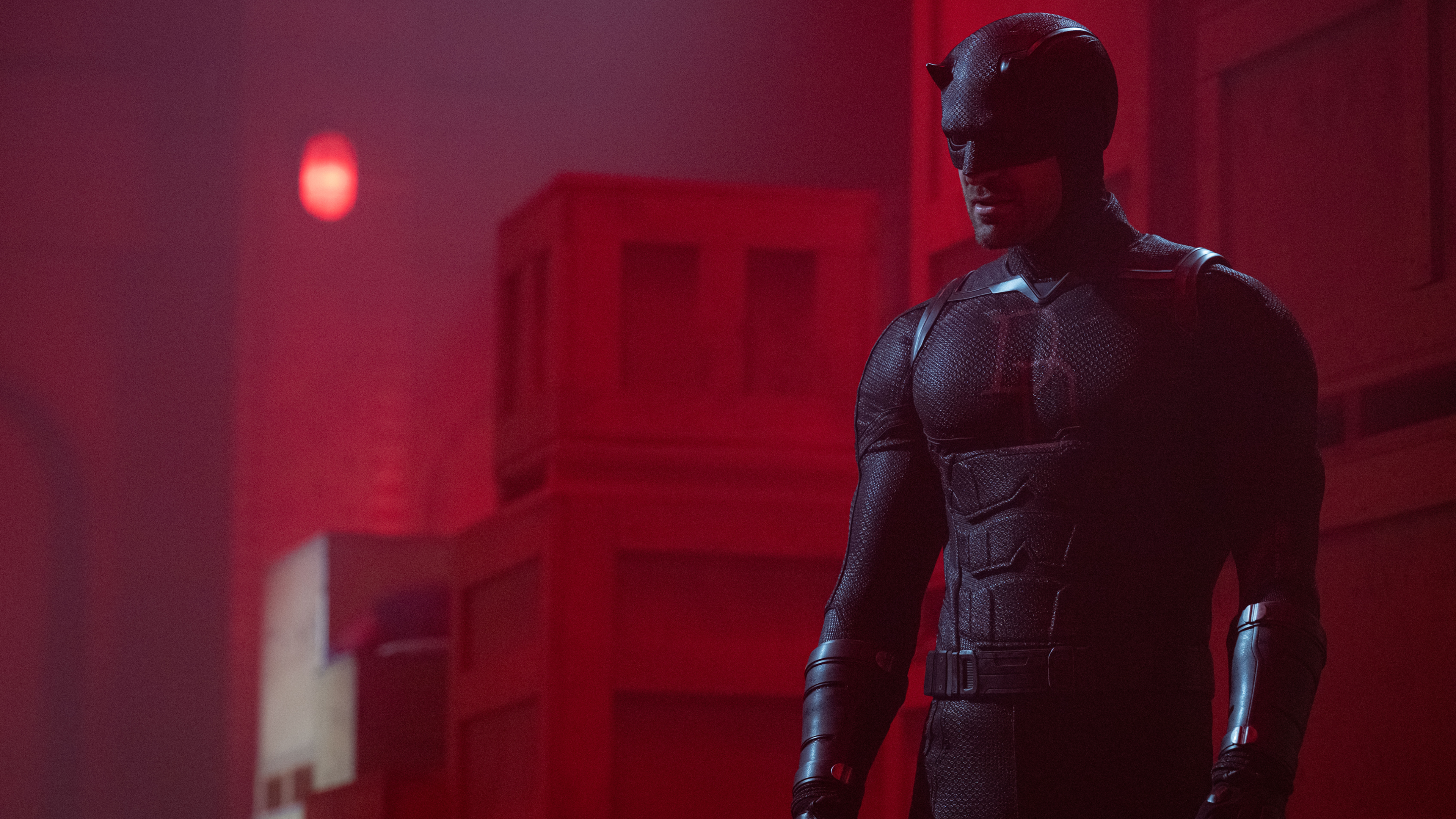 Daredevil (Charlie Cox) extending a hand towards camera