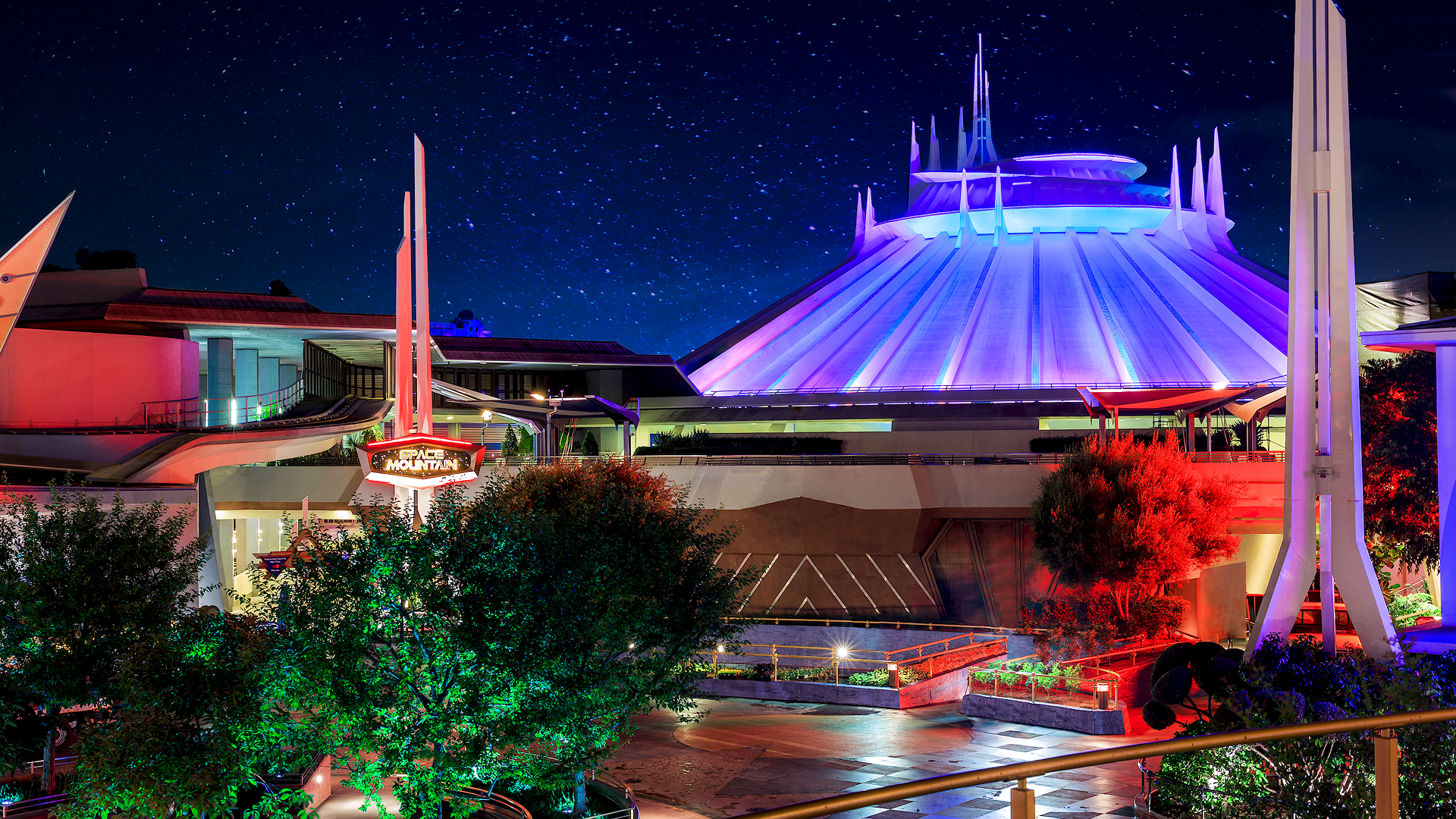 This is a photograph of Space Mountain at Disneyland in Tomorrowland at night.