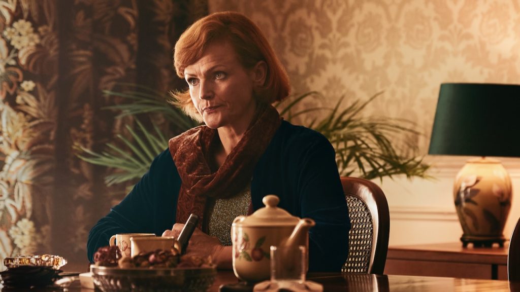 A still image of Maxine Peake as older Dolours Price in the series, Say Nothing.