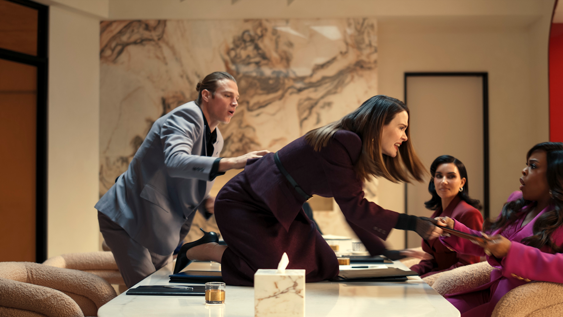 "Carr" Lane (played by Sarah Paulson) confronts another woman during a meeting.