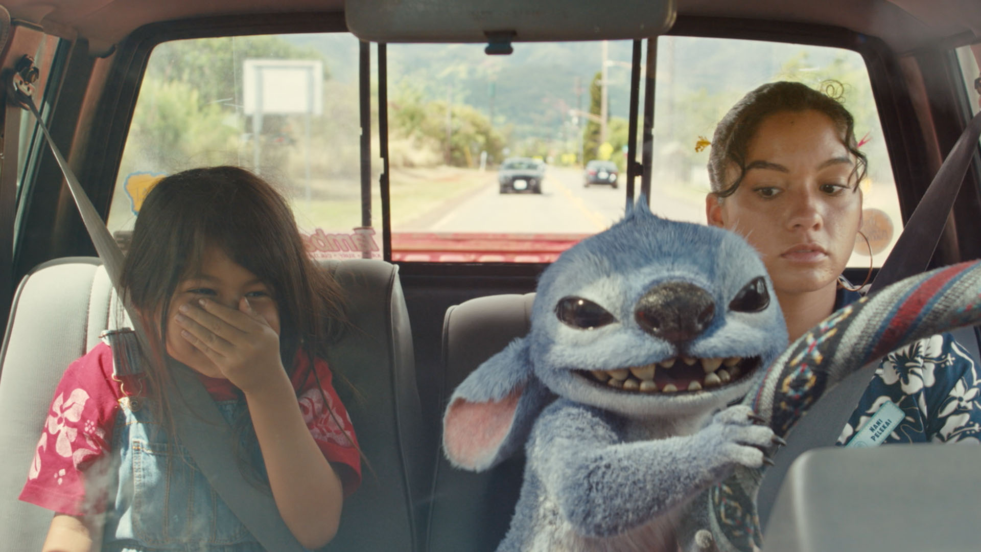Maia Kealoha as Lilo, Sydney Agudong as Nani, and Stitch in Lilo & Stitch (2025)