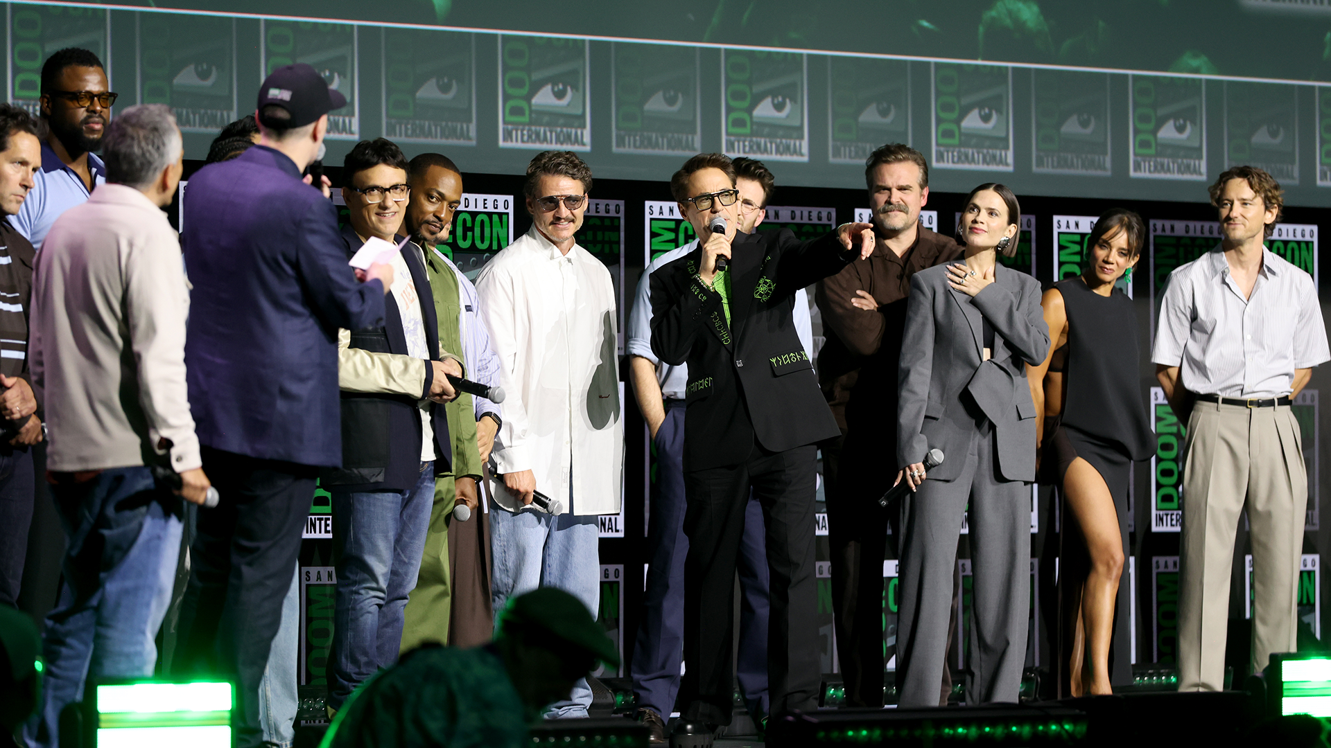 SAN DIEGO, CALIFORNIA - JULY 25: (L-R) Paul Rudd, Winston Duke, Joe Russo, Kevin Feige, President, Marvel Studios, Anthony Russo, Anthony Mackie, Pedro Pascal, Robert Downey Jr., Chris Evans, David Harbour, Hayley Atwell, Hannah John-Kamen and Lewis Pullman speak onstage during the Marvel Studios Panel at 2026 San Diego Comic-Con on July 25, 2026 in San Diego, California.