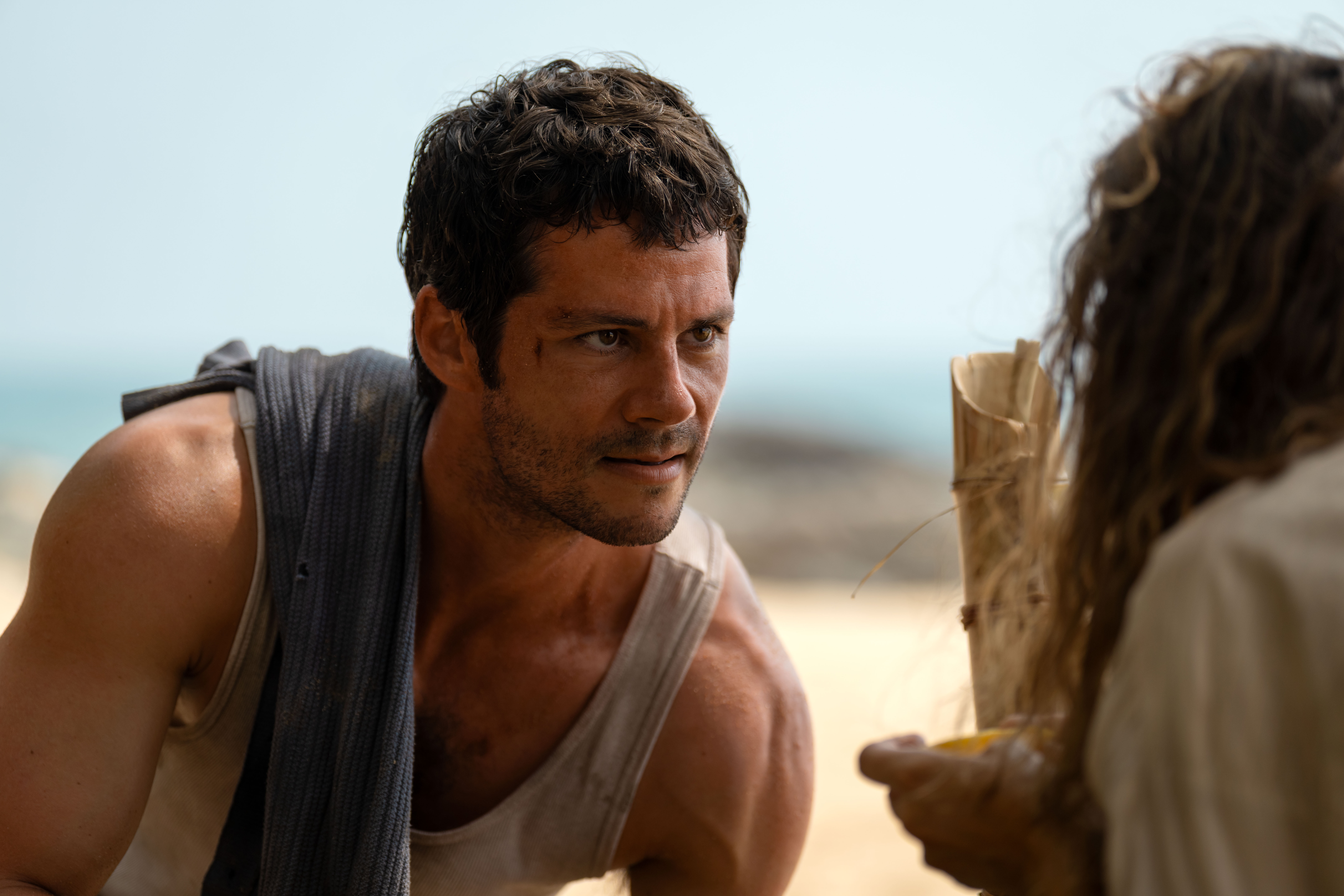 Dylan O'Brien starring in a scene of Send Help. O'Brien plays Bradley Preston, a boss who is stranded on a deserted island with his employee Linda Liddle.