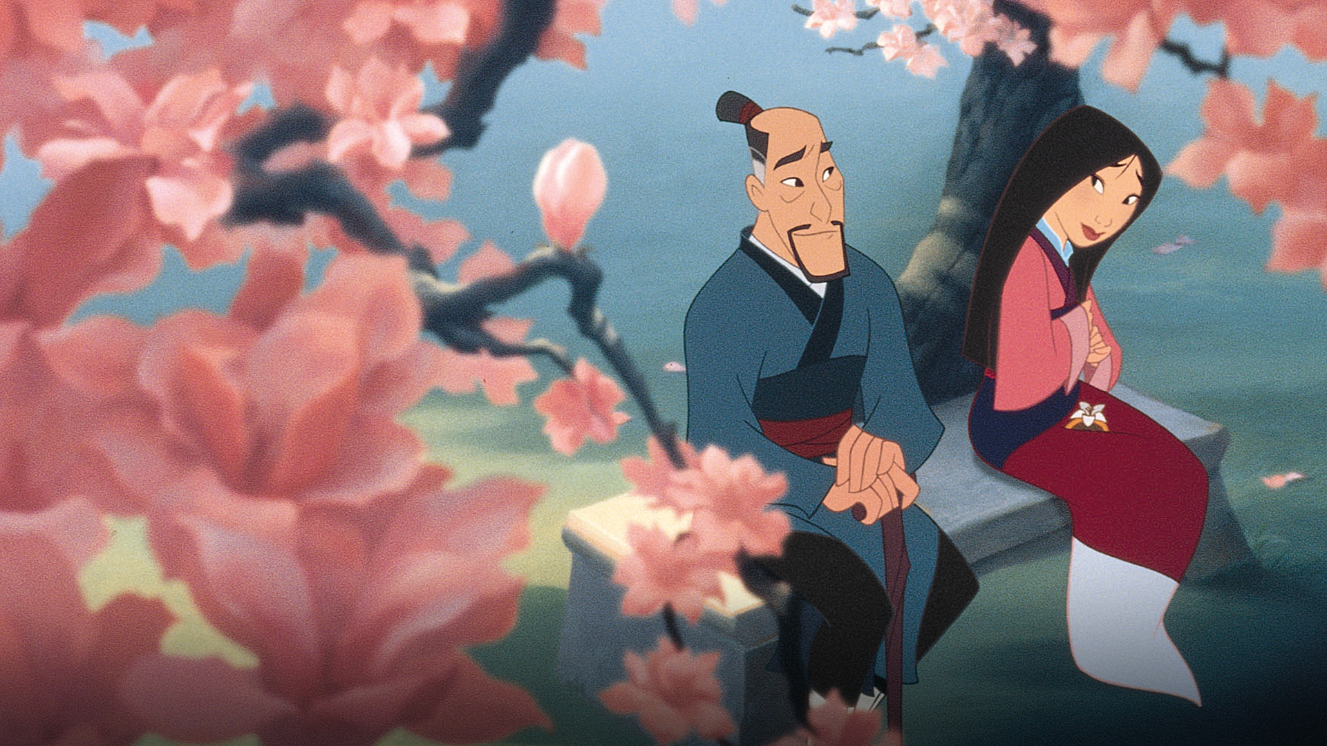 An animated, serene scene from Mulan shows Fa Zhou (Soon-Tek Oh) looking warmly at his daughter, Mulan (Ming-Na Wen), as they sit together on a stone bench beneath a blooming magnolia tree with soft pink blossoms surrounding them.