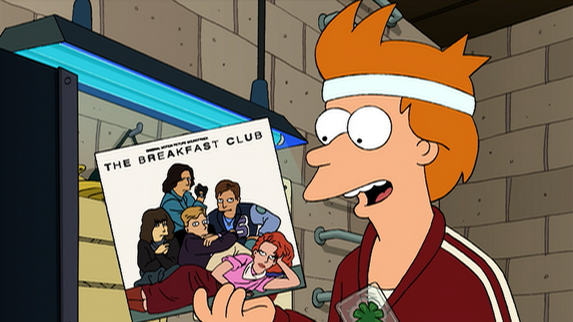 Fry (Billy West) smiles while wearing a white headband and holding up a record titled The Breakfast Club.