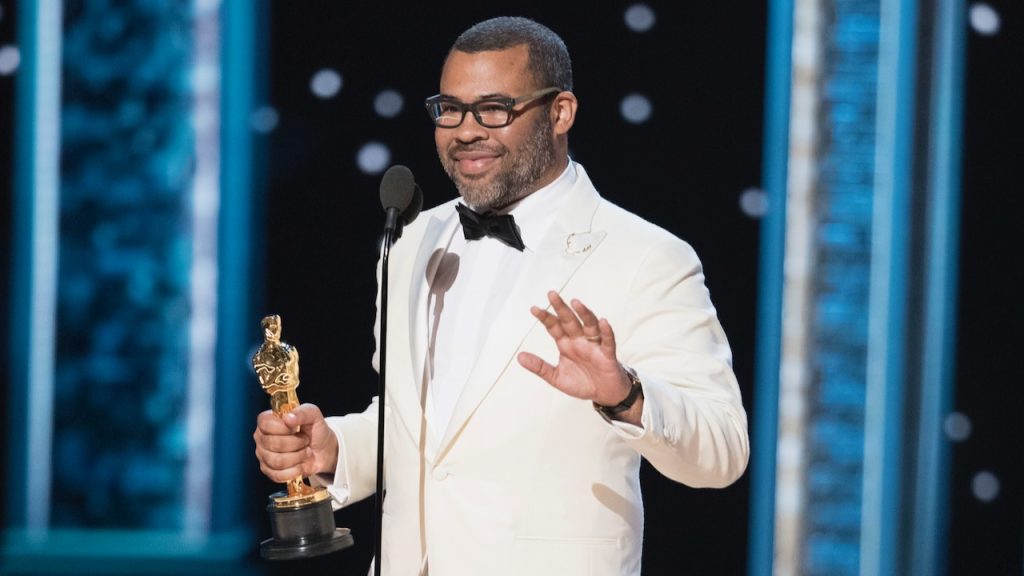 A still image of Jordan Peele at the Oscars.