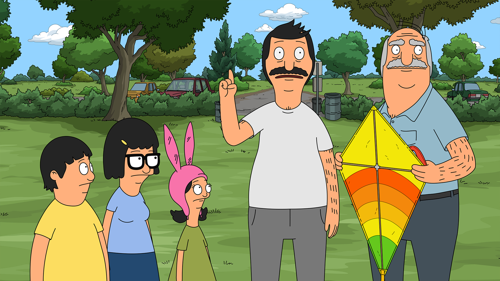 An animated scene from Bob's Burgers shows Bob Belcher (H. Jon Benjamin) raising his index finger to make a point, standing in a park alongside Gene (Eugene Mirman), Tina (Dan Mintz), Louise (Kristen Schaal), and Teddy (Larry Murphy), who is holding a colorful, striped kite.