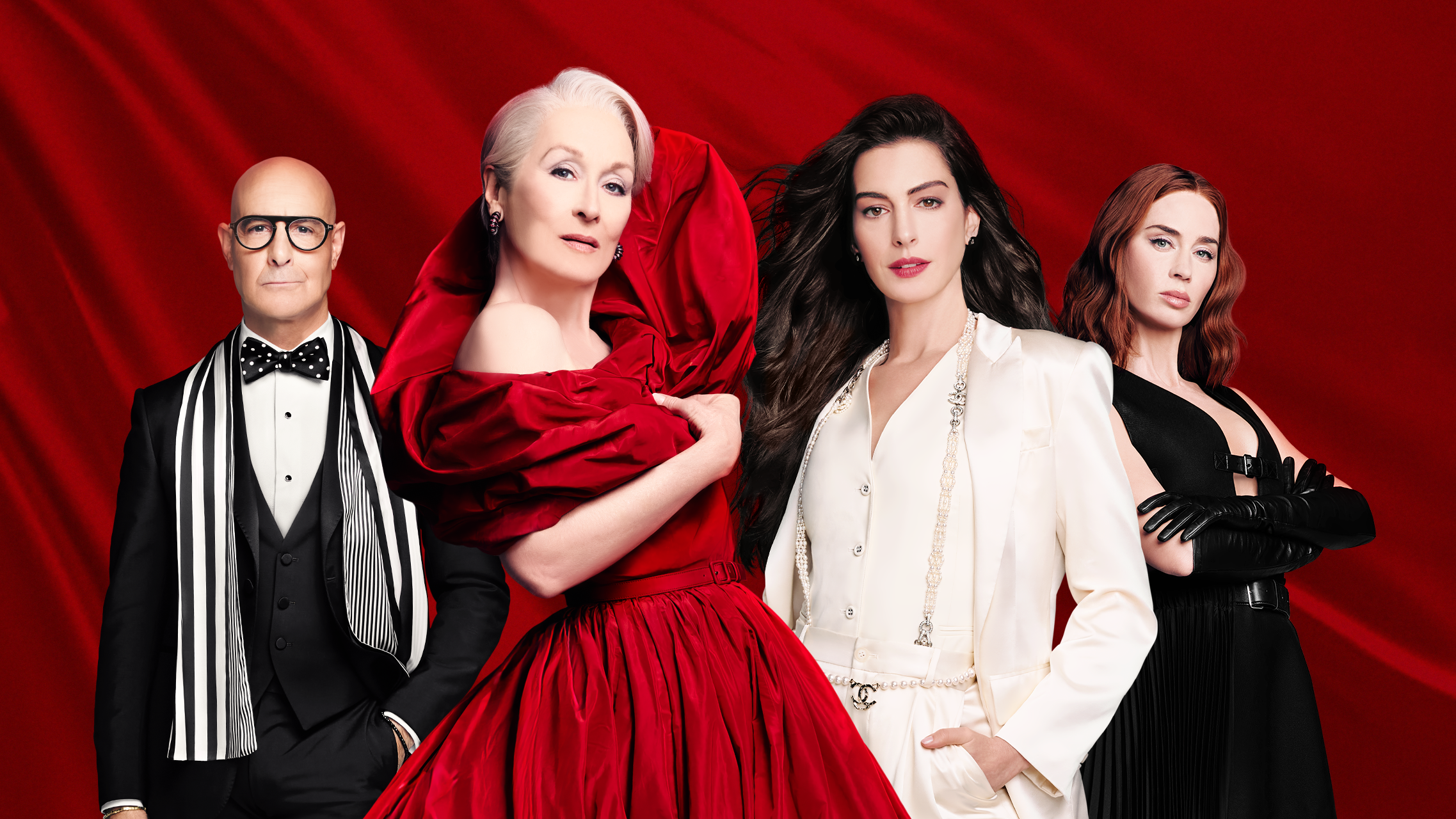 Stanley Tucci, Meryl Streep, Anne Hathaway, and Emily Blunt in front of a red background on a poster for The Devil Wears Prada 2