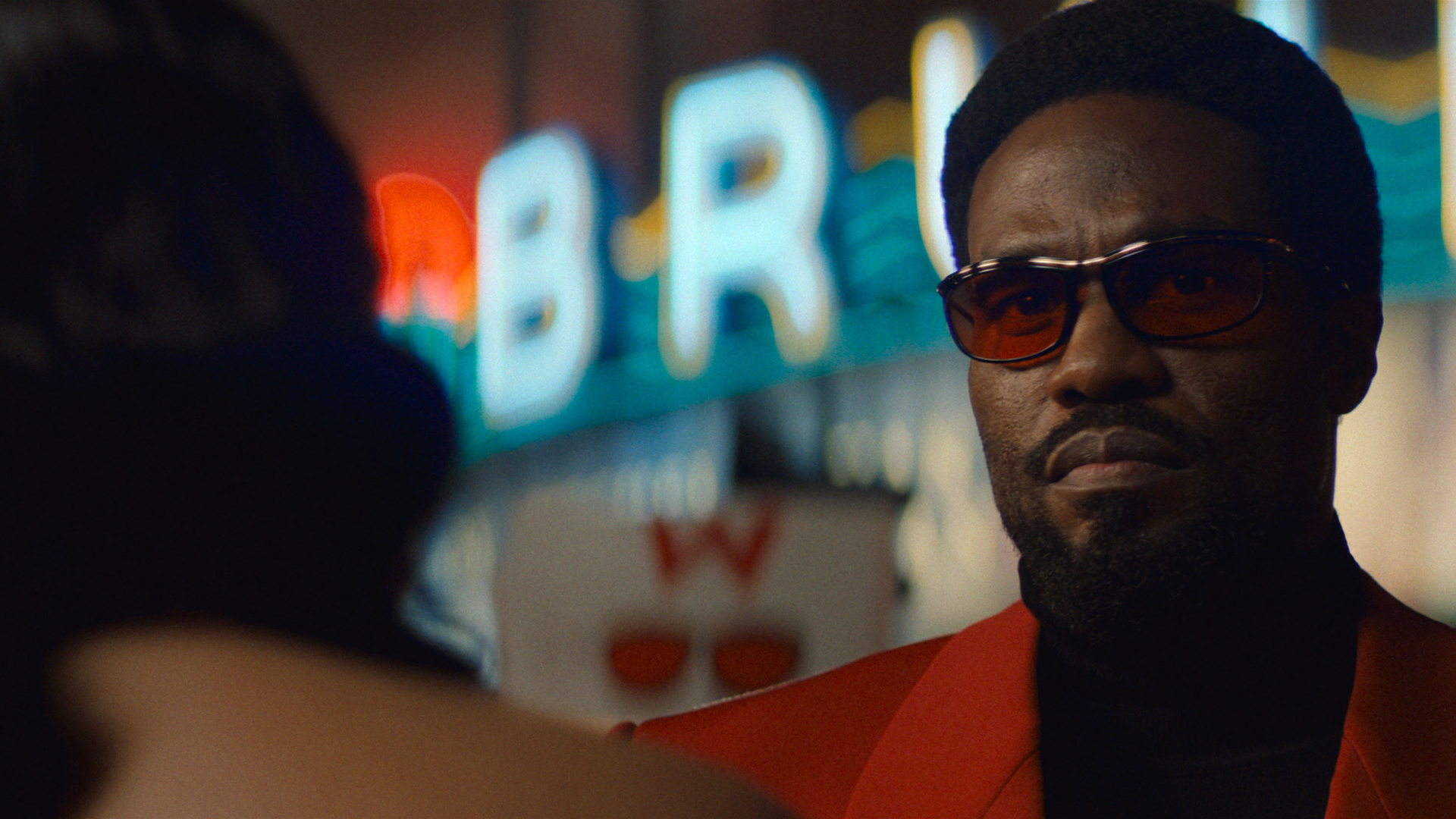 A closeup of Wonder Man (Yahya Abdul-Mateen II) wearing sunglasses in Wonder Man