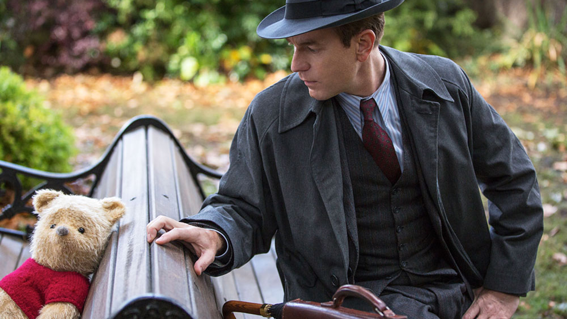 The scene depicts a reunion between the adult Christopher Robin and his childhood friend, Winnie-the-Pooh in a scene from the 2018 live-action film Christopher Robin. 