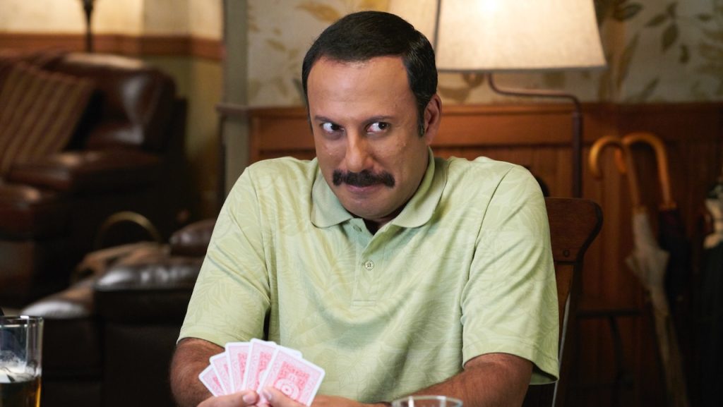 A still image of Rizwan Manji as Ray Butani in an episode of Schitt’s Creek.
