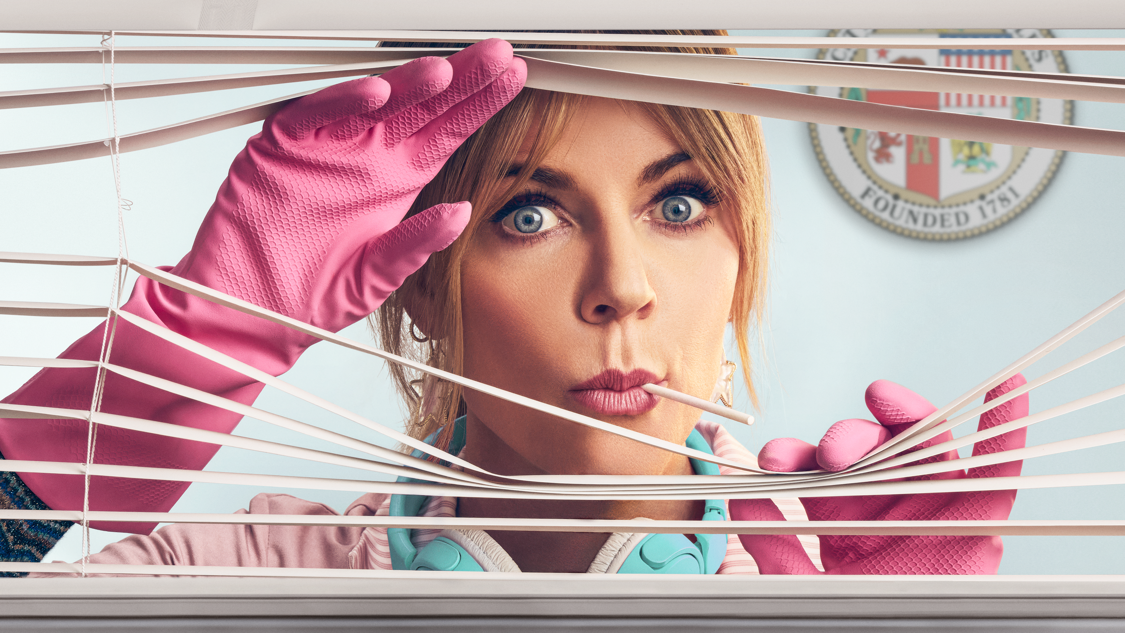 Kaitlin Olson as Morgan Gillory peeking through window blinds wearing pink cleaning gloves in promotional imagery for High Potential