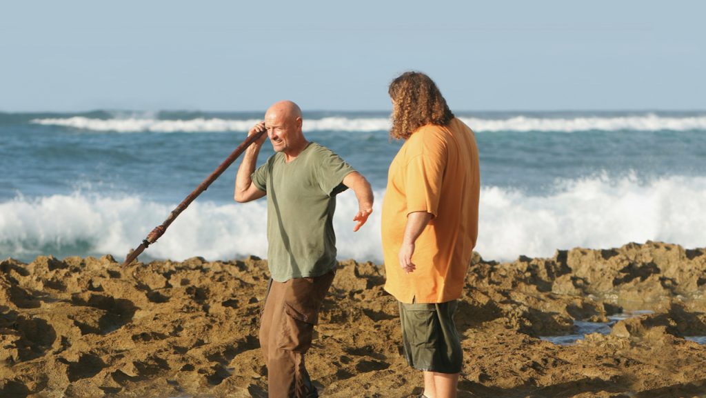 A still image of Jorge Garcia as Hugo Reyes and Terry O’Quinn as John Locke in the TV show, Lost.