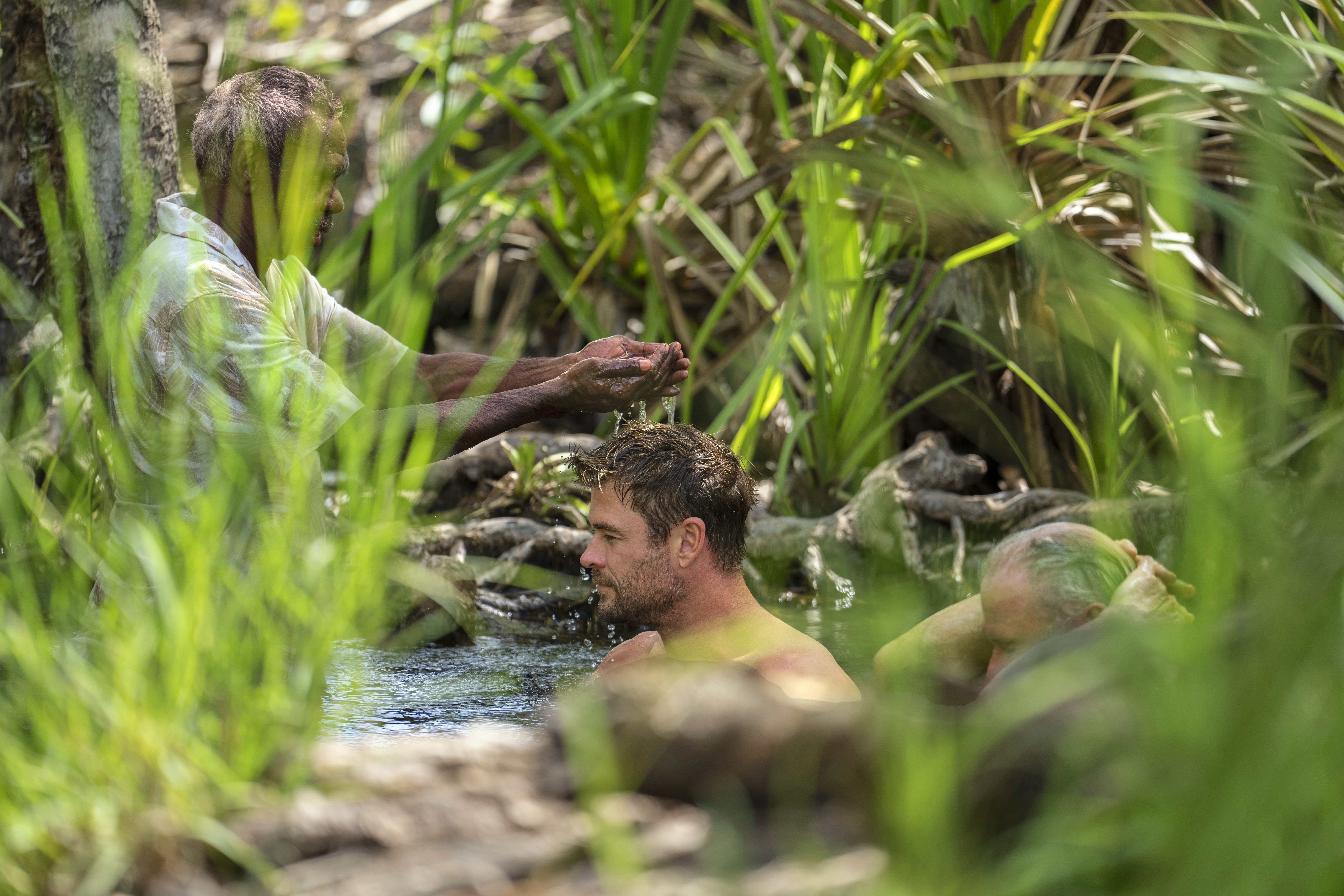Chris and his father Craig take part in a blessing with Spencer. The welcome is a spiritual ceremony. The significance is to let the spirits know that Chris and Craig are back. (Credit: National Geographic/Craig Parry)