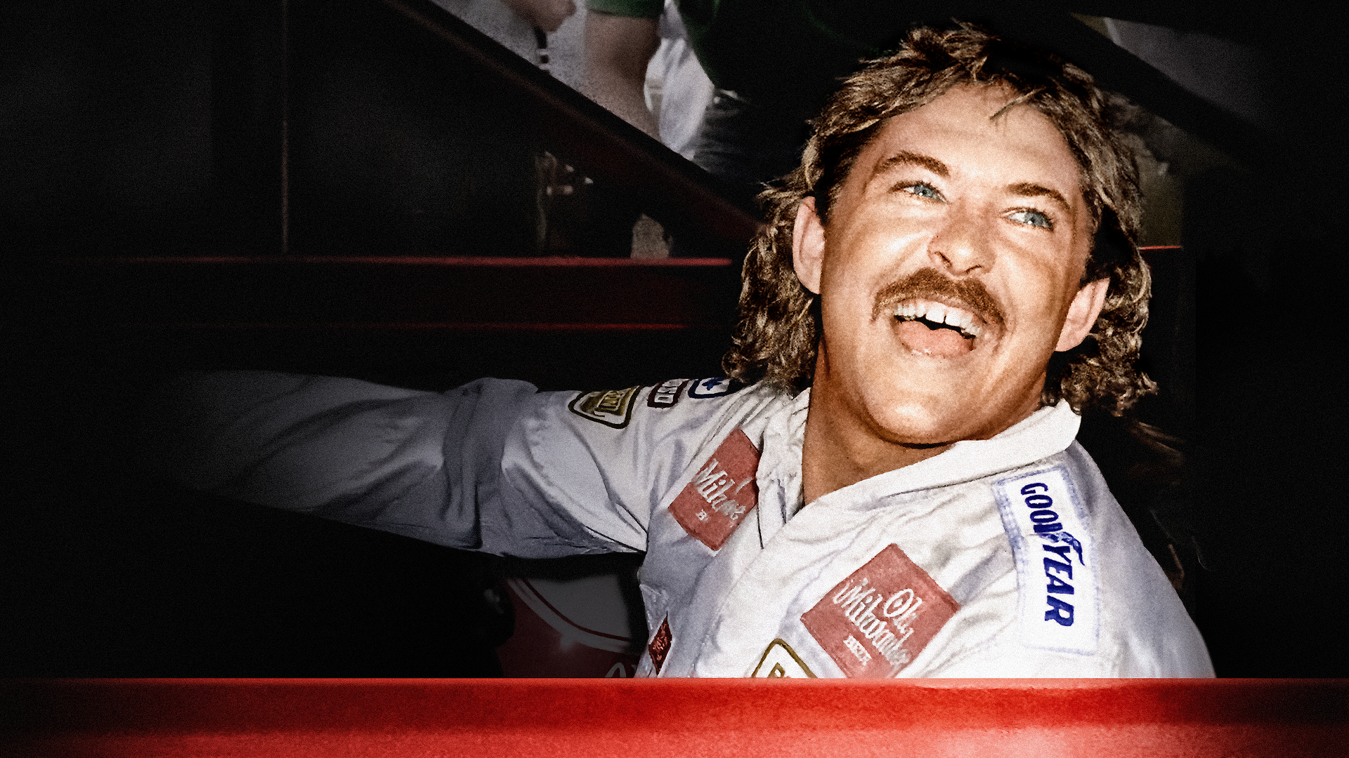 This image shows American race car driver Tim Richmond, a flamboyant NASCAR star known for his daring driving style in the 1980s.