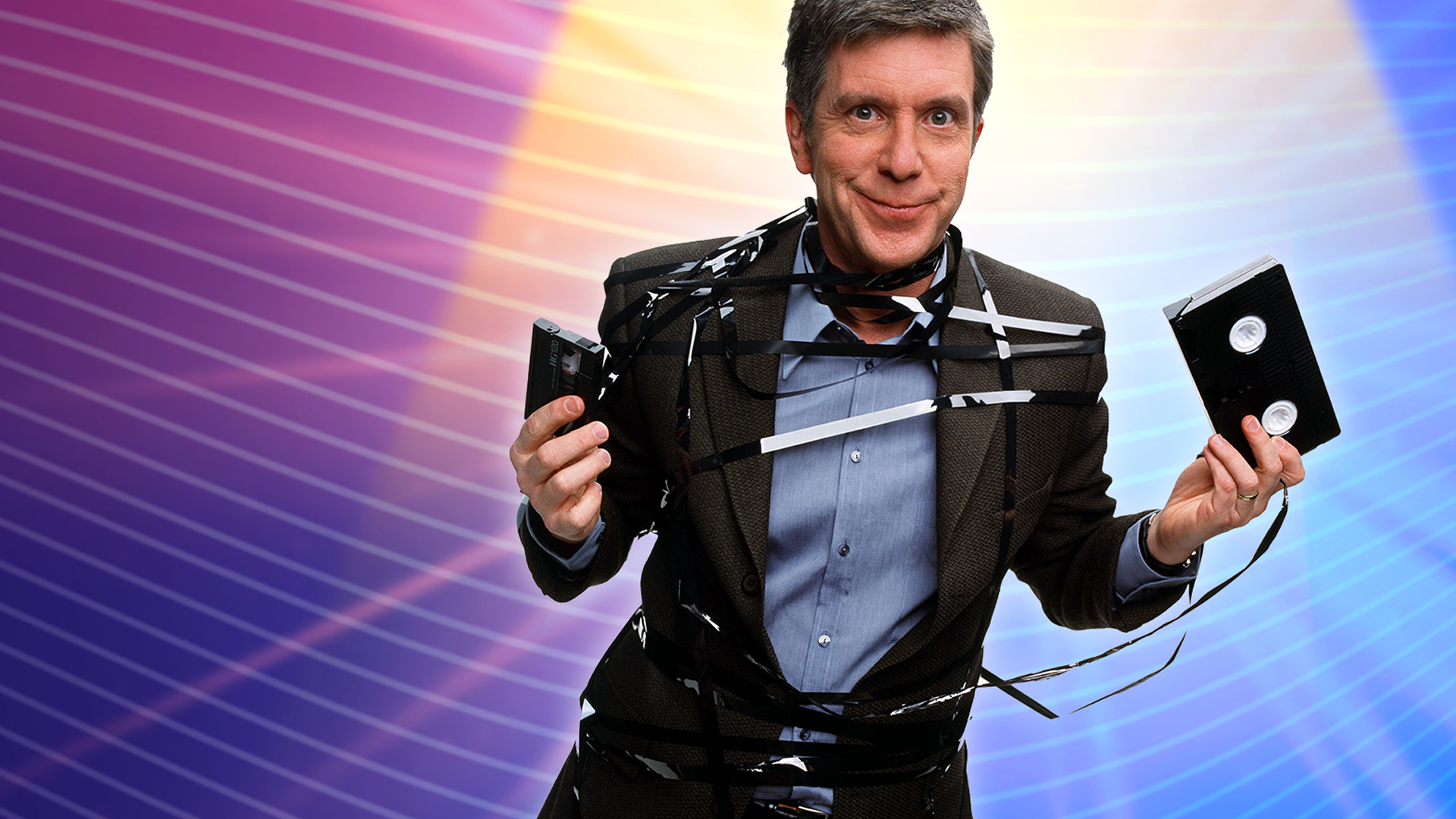This image features television host Tom Bergeron in a classic promotional image for ABC's hit show America's Funniest Home Videos