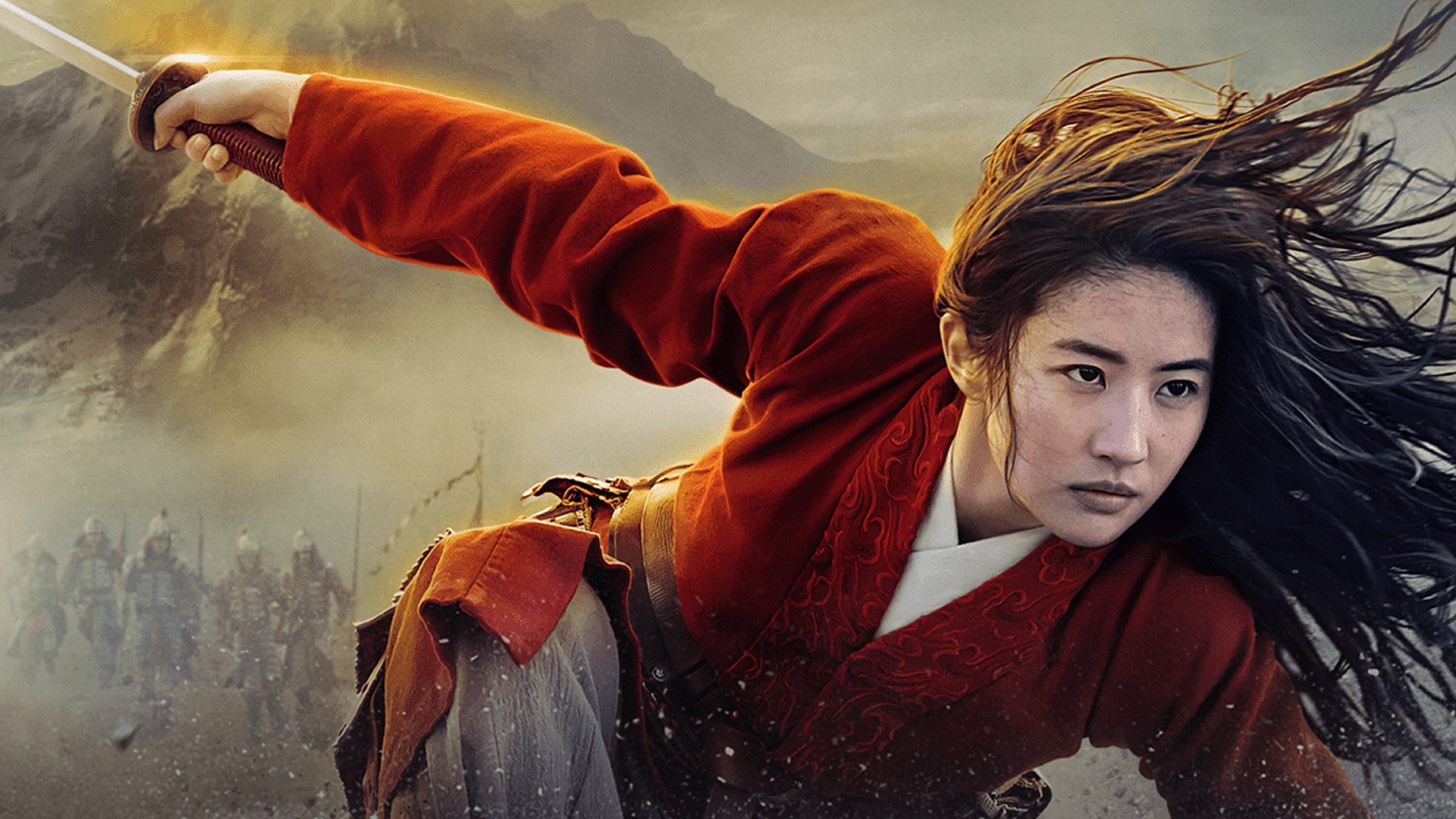 Mulan (Yifei Liu) crouches forward with an intense expression, her long dark hair flowing in the wind, as she dynamically wields a sword with her right arm extended while a line of soldiers marches behind her against a smoky, mountainous backdrop.