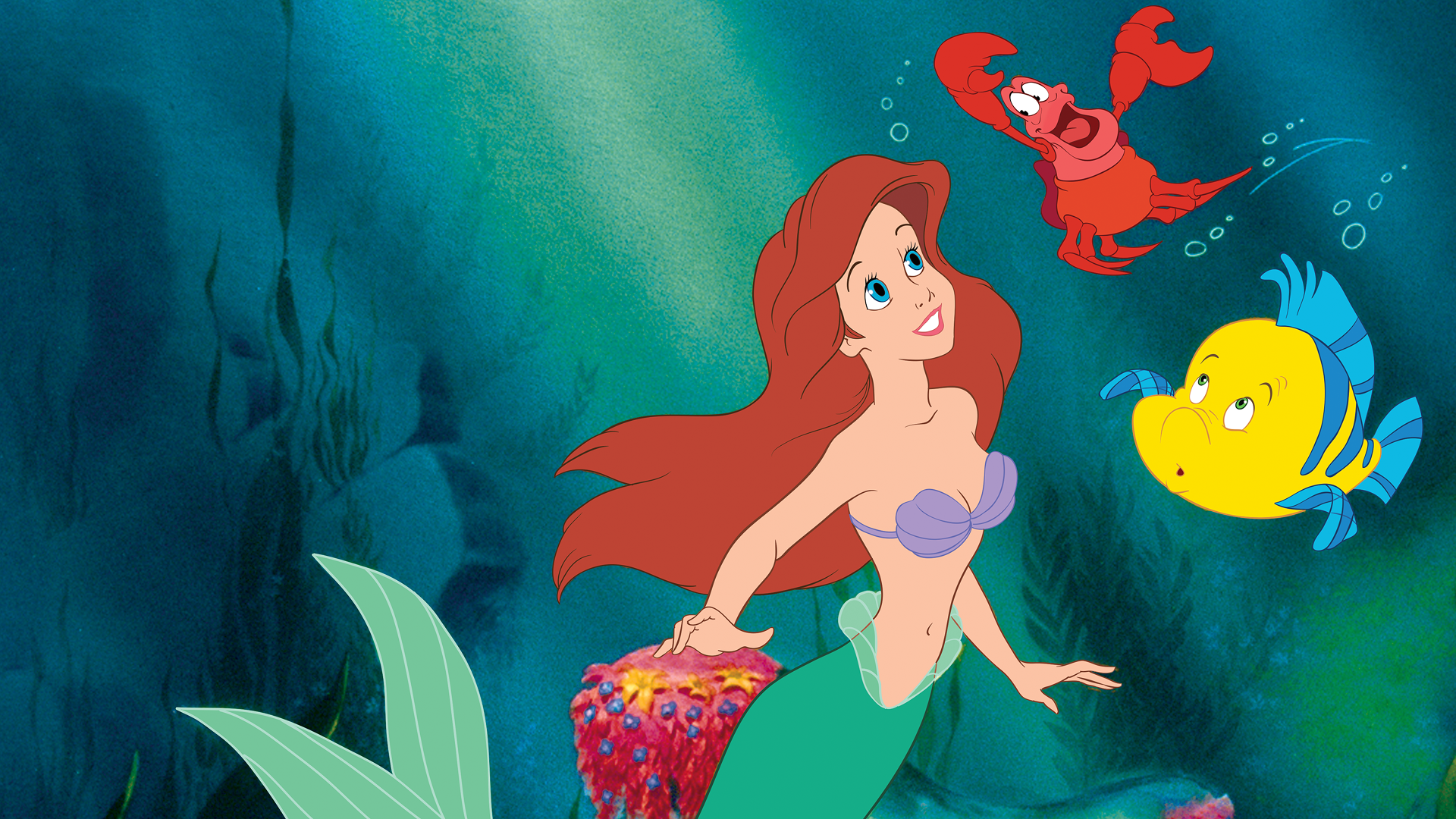 Ariel swims with Flounder and Sebastian in The Little Mermaid (1989)