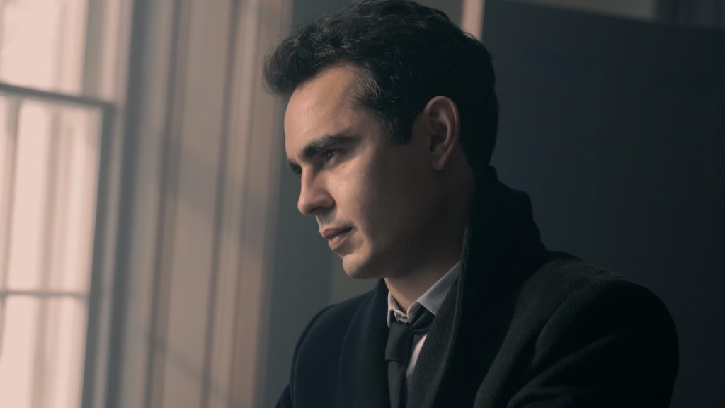 A still image of Max Minghella as Nick Blaine in The Handmaid’s Tale.