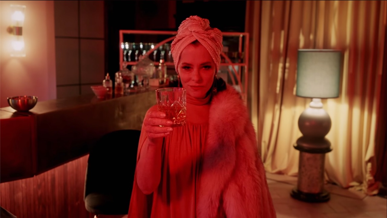 Parker Posey serves as the host and ring leader of The Mob.