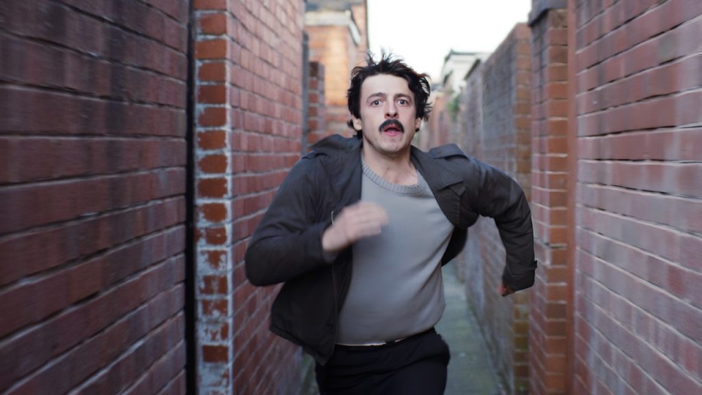A still image of Anthony Boyle as Brendan Hughes in the series, Say Nothing.