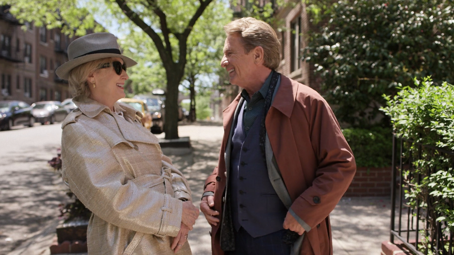 Oliver Putnam (Martin Short) and Loretta Durkin (Meryl Streep) laughing together on a sunny sidewalk
