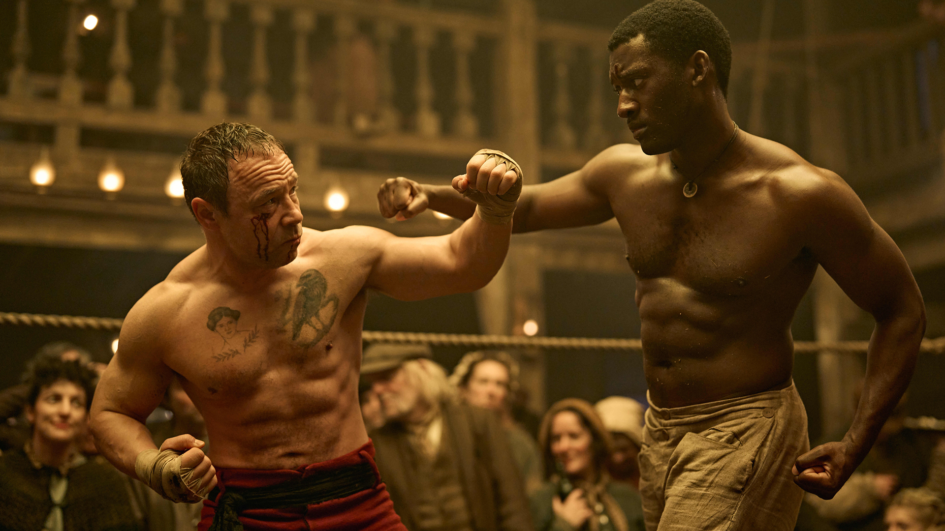 Sugar Goodson (Stephen Graham) defende um soco de Hezekiah Moscow (Malachi Kirby) no ringue de boxe.