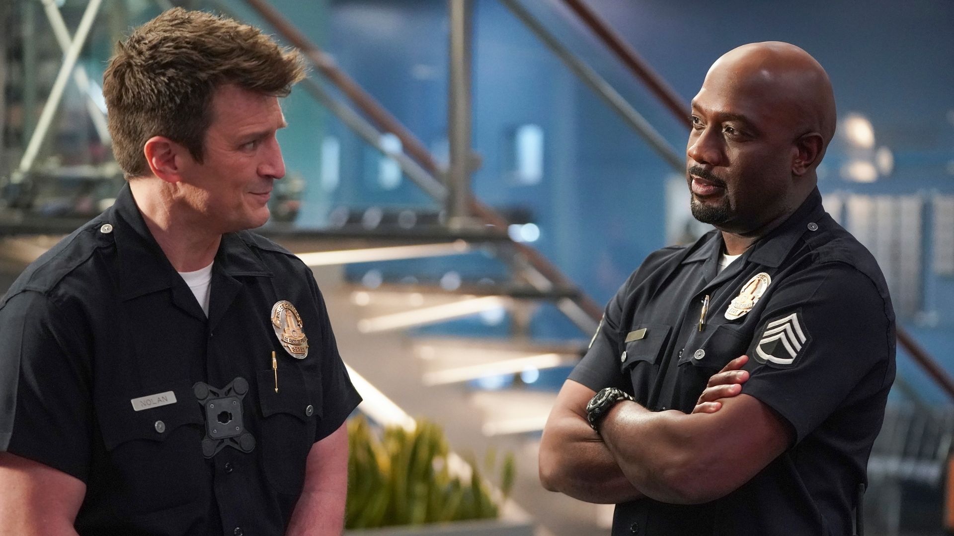 Officer Nolan and Sergeant Grey share a conversation in a scene from The Rookie.