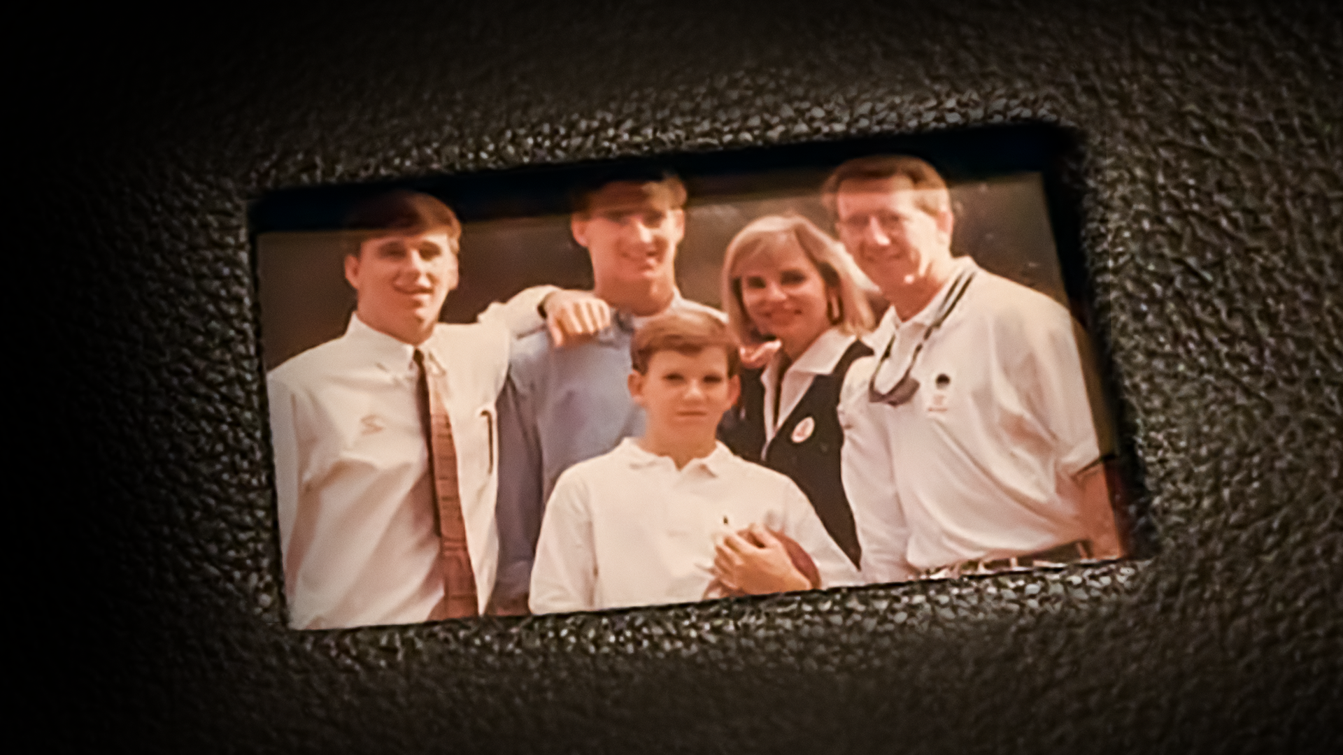 This image features the Manning family, a prominent sports family, captured in a portrait from the early 1990s.