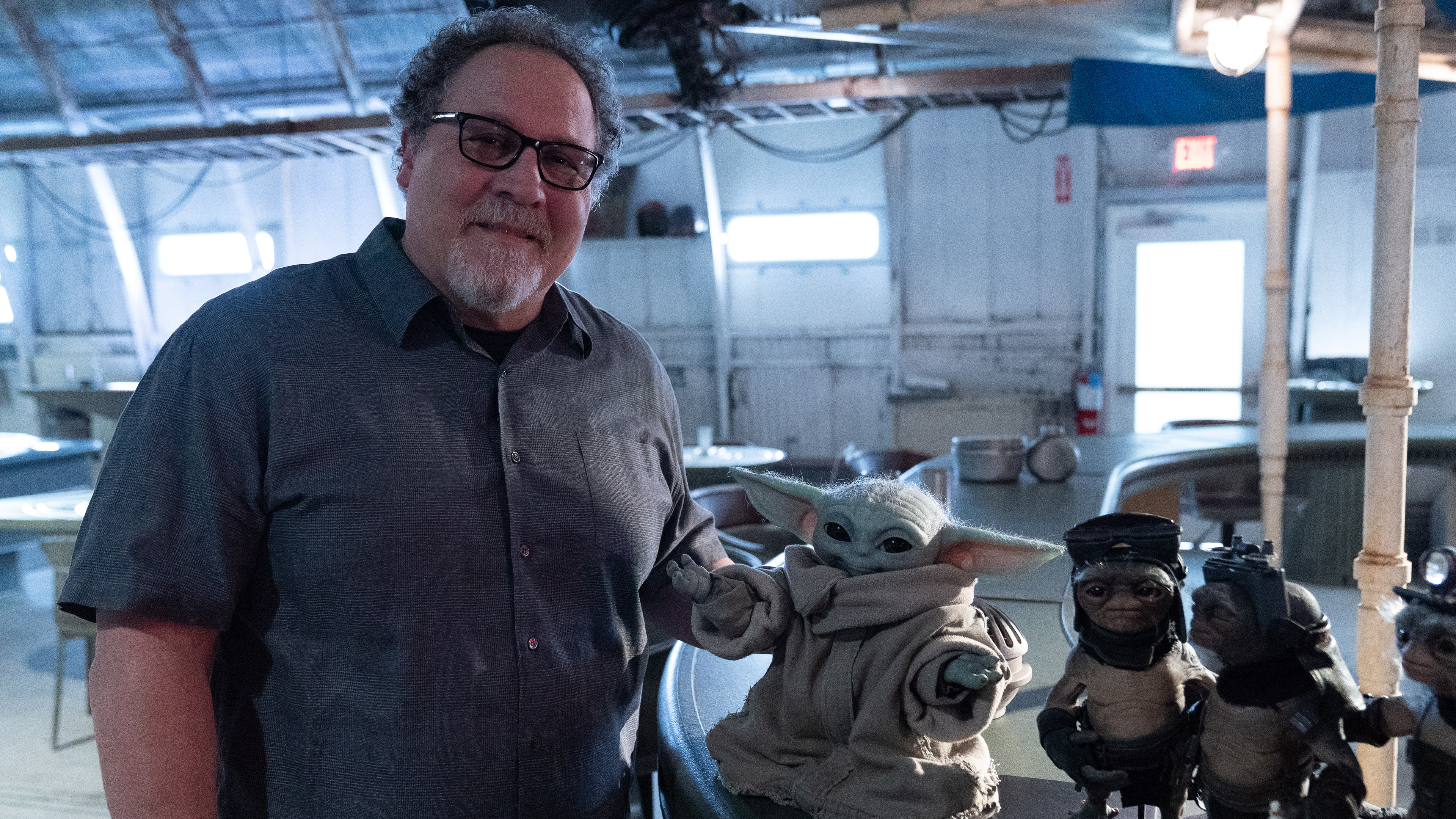Jon Favreau with the Grogu puppet in Disney Worldbuilders.