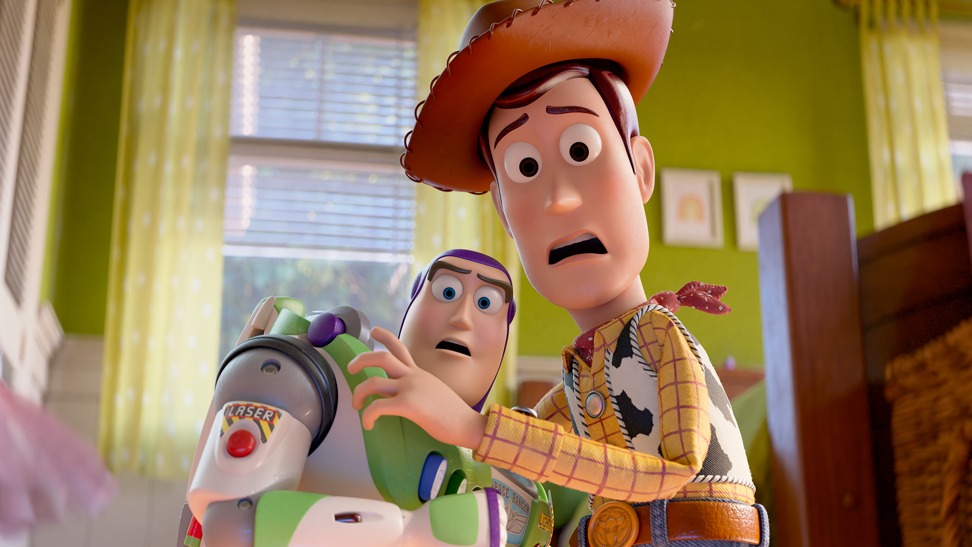 An official promotional image from Disney and Pixar's "Toy Story 5" shows Woody (Tom Hanks) and Buzz Lightyear (Tim Allen) standing together in a bedroom with shocked and alarmed facial expressions.