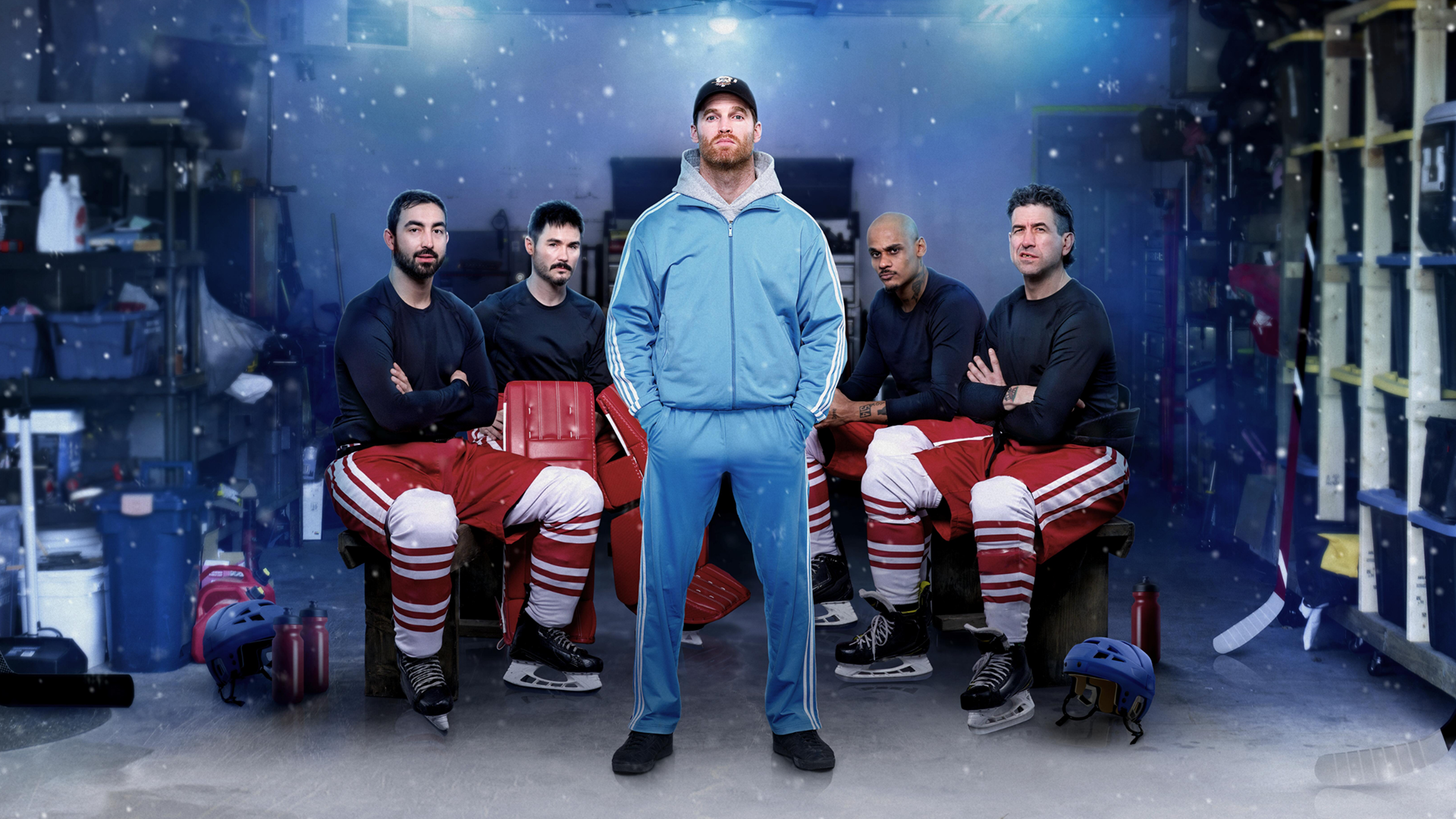 Shoresy (Jared Keeso) stands in a garage in front of his hockey teammates
