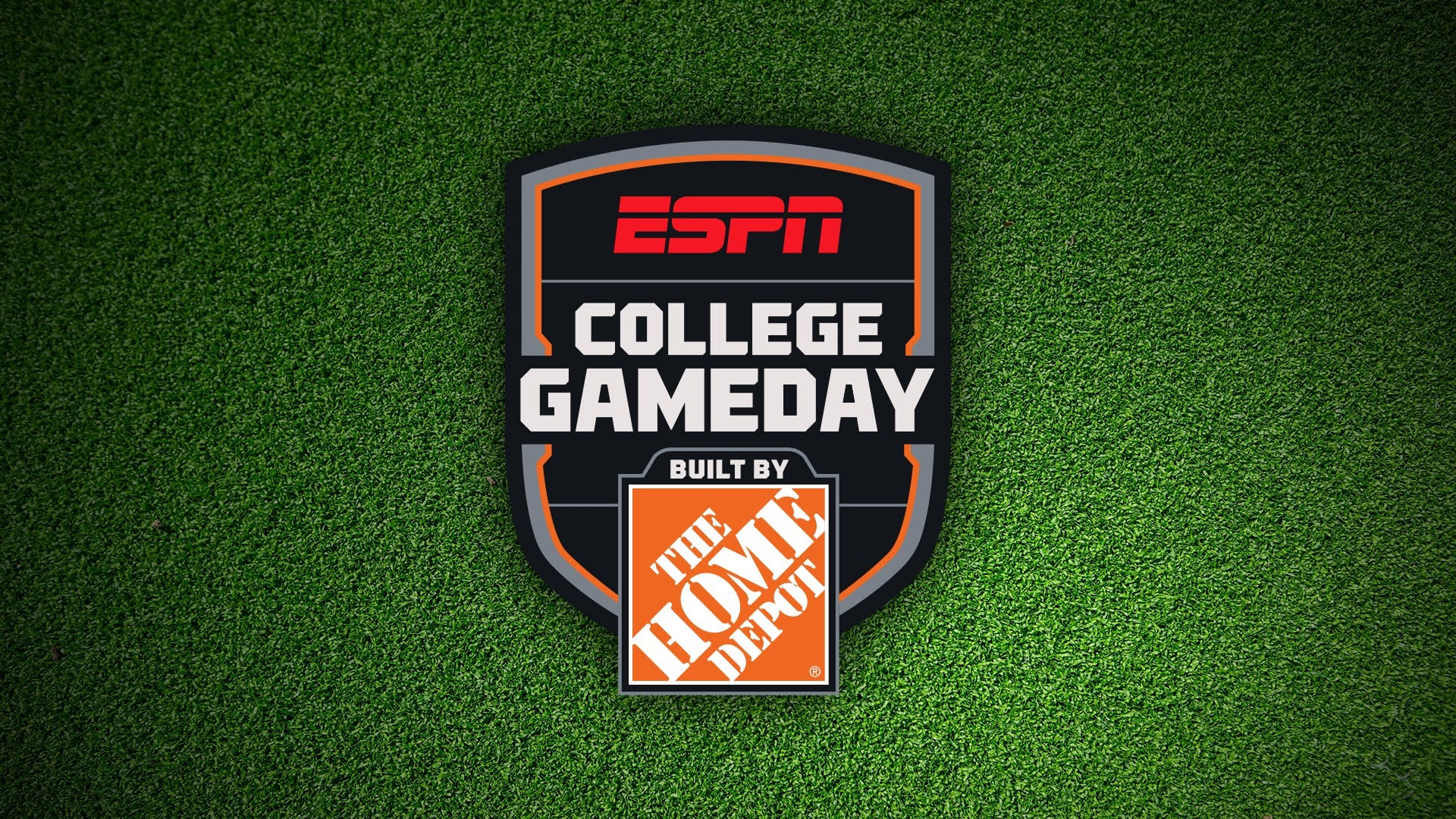 The ESPN College GameDay logo, featuring "Built by The Home Depot" branding, is centered on a textured green turf background.