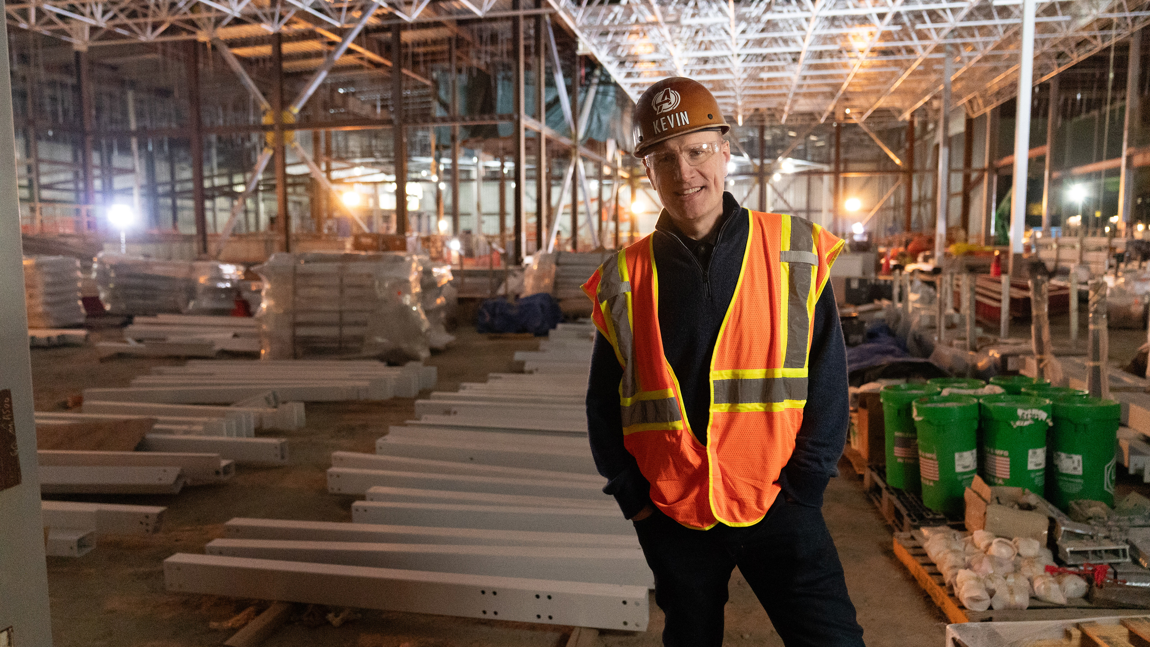 Kevin Feige at an attraction construction site in Disney Worldbuilders.
