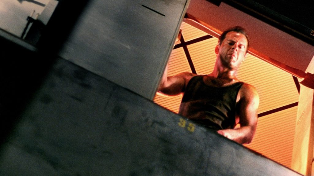 A still image of Bruce Willis from Die Hard, considered one of the best ’80s movies.
