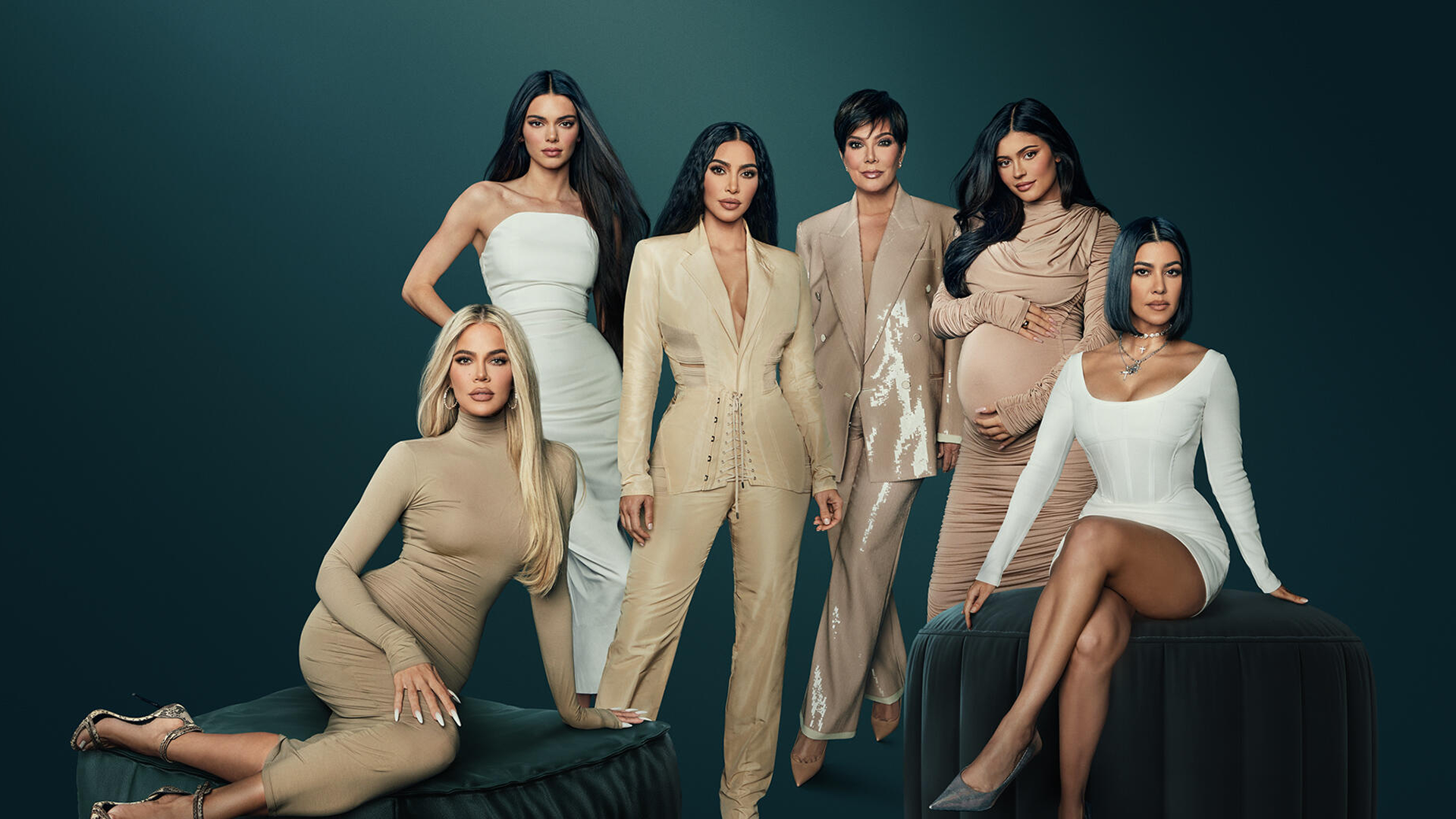 A picture of the Kardashian / Jenner sisters and Kris Jenner, all dressed in white and beige